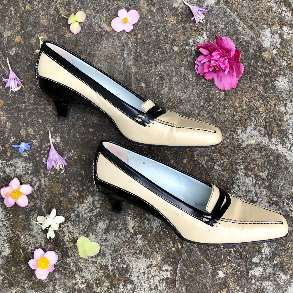 Beige and black Tod’s loafer pumps